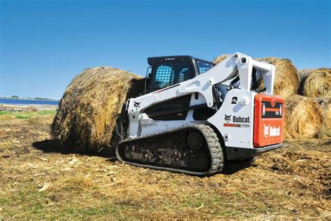 track skid steer climb angle|bobcat skid steering slope.